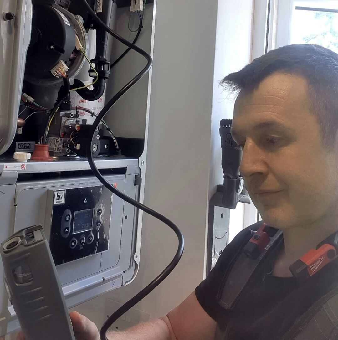 Gas Safe engineer carrying out a boiler inspection in Five Ash Down Gas Safe engineer carrying out a boiler inspection in Five Ash Down