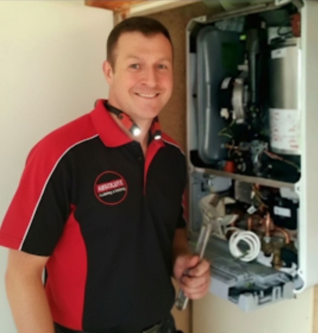 Gas Safe engineer carrying out a boiler repair in Crowborough home Gas Safe engineer carrying out a boiler repair in Crowborough home